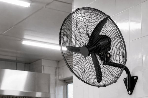 Commercial kitchen and gymnasium space with wall ventilation